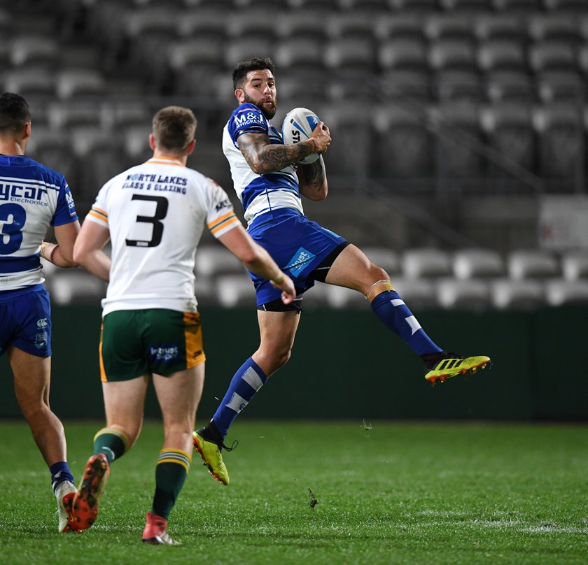 Up Above: Mason Cerruto latches onto a high ball in the Bulldogs' semi-final win over the Wyong Roos