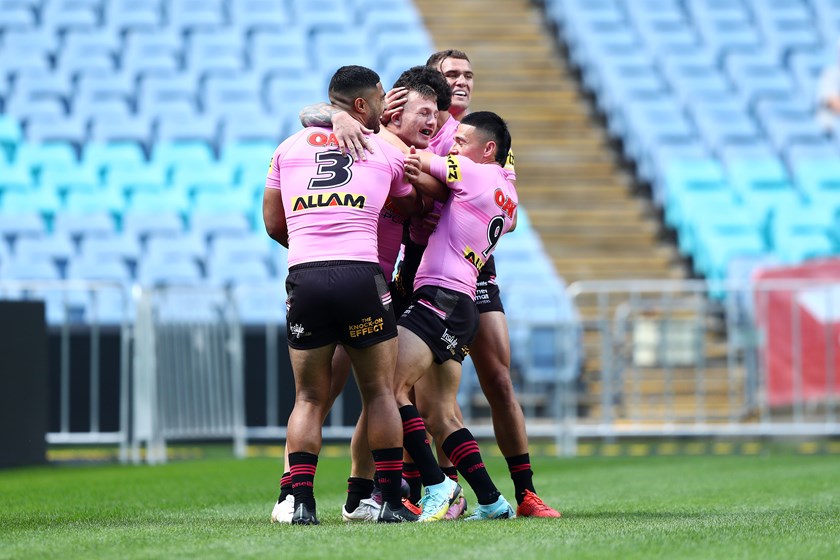 J'maine Hopgood celebrates with teammates after his try.