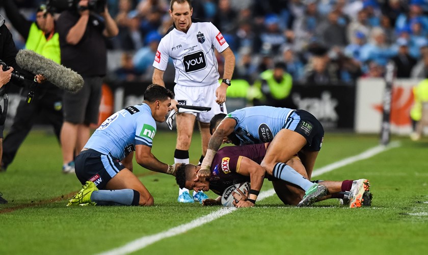 An example of Latrell Mitchell's aggression in State of Origin as he helped bundle Dane Gagai into touch. Photo: NRL Photos