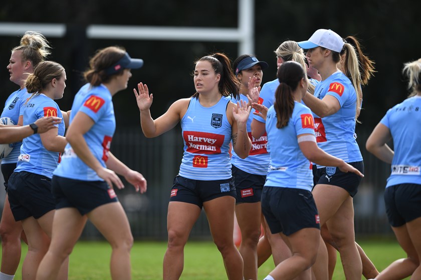 Co-captains Isabelle Kelly (centre) and Kezie Apps (baseball cap) at Sky Blues training