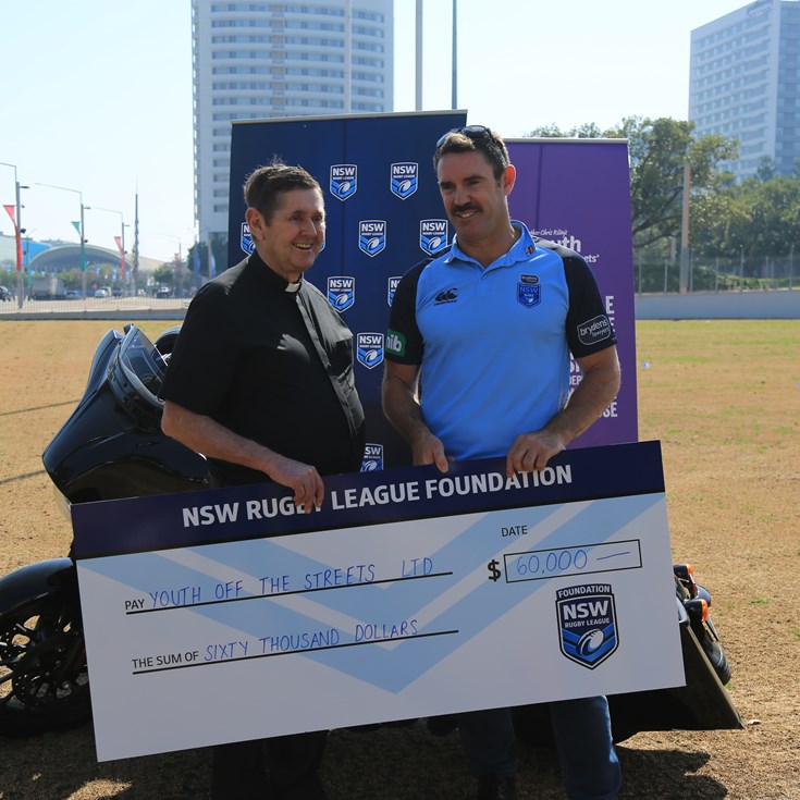 Fittler presents cheque as Hogs total hits $760,000