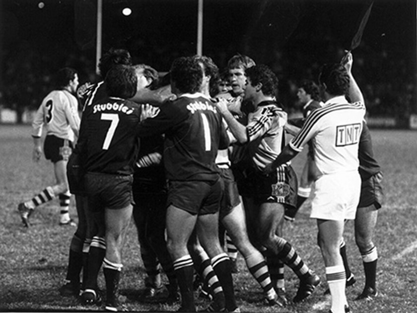 A fight breaks out in the first State of Origin match played in 1980 - which Queensland won 20-10.