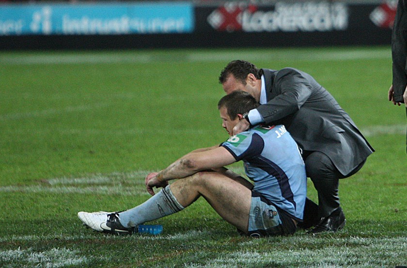 Ricky Stuart consoles a devastated Josh Morris after the heartbreaking Game Three defeat in 2012.